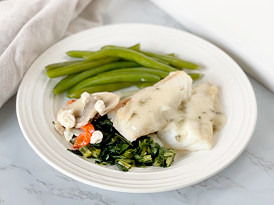 Boston Cod in Lemon Herb Sauce with Greens, a Red Pepper & Mushroom Blend, and Green Beans